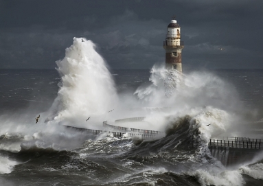 Stormy sea and lighthouse